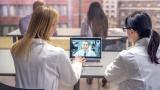 Nurse helps a patient with their Portal Log in