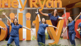 Group of nurses in front of Shirley Ryan AbilityLab sign