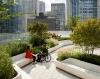 urban garden with couple talking, one in a wheelchair